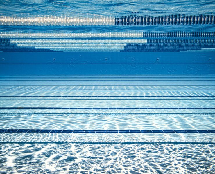 Olympic Swimming pool underwater background.