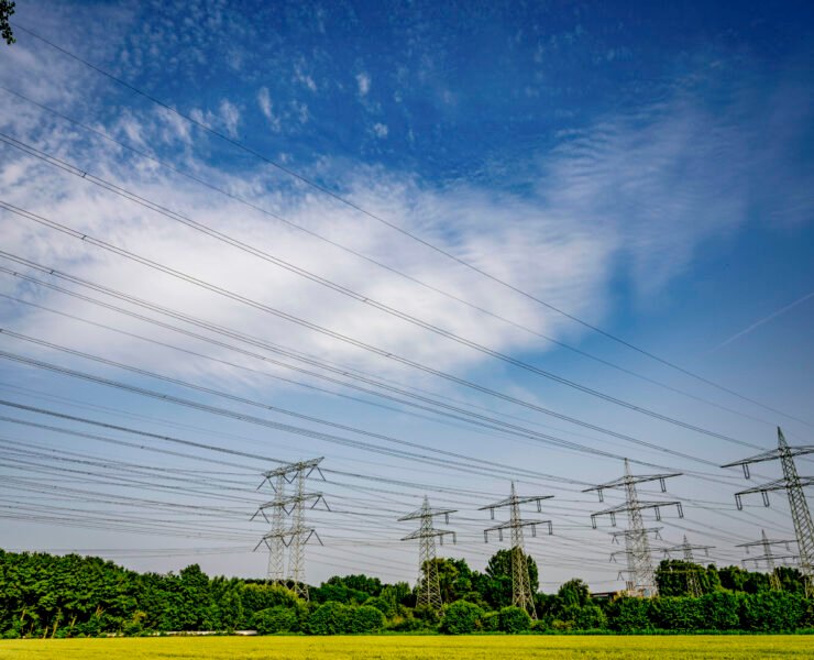 Power lines stretching across a vibrant sky